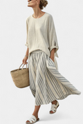 Aurora – comfortable blouse and striped midi skirt