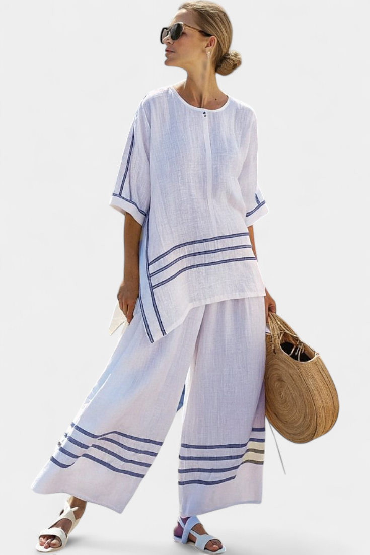Vittorina – sophisticated striped asymmetric top and bold trousers