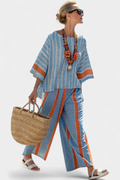Valeria – sophisticated terracotta striped top and linen trousers
