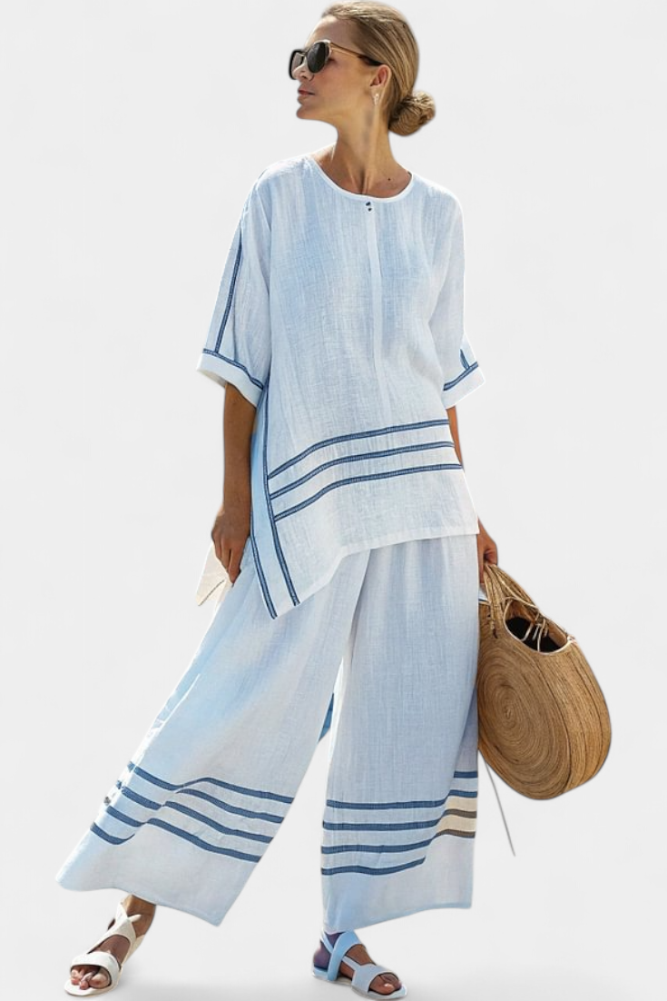 Vittorina – sophisticated striped asymmetric top and bold trousers