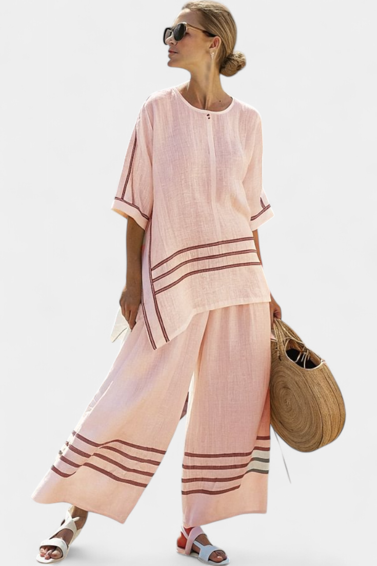 Vittorina – sophisticated striped asymmetric top and bold trousers