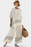 Vittorina – sophisticated striped asymmetric top and bold trousers