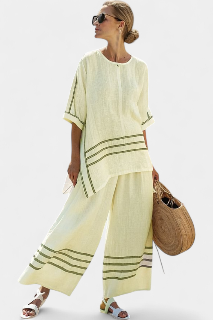 Vittorina – sophisticated striped asymmetric top and bold trousers