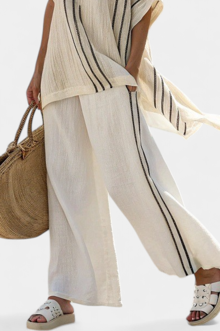 Raffaella – Elegant ivory linen blouse and black striped trousers