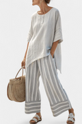 Fiorella – elegant asymmetric blouse and striped trousers
